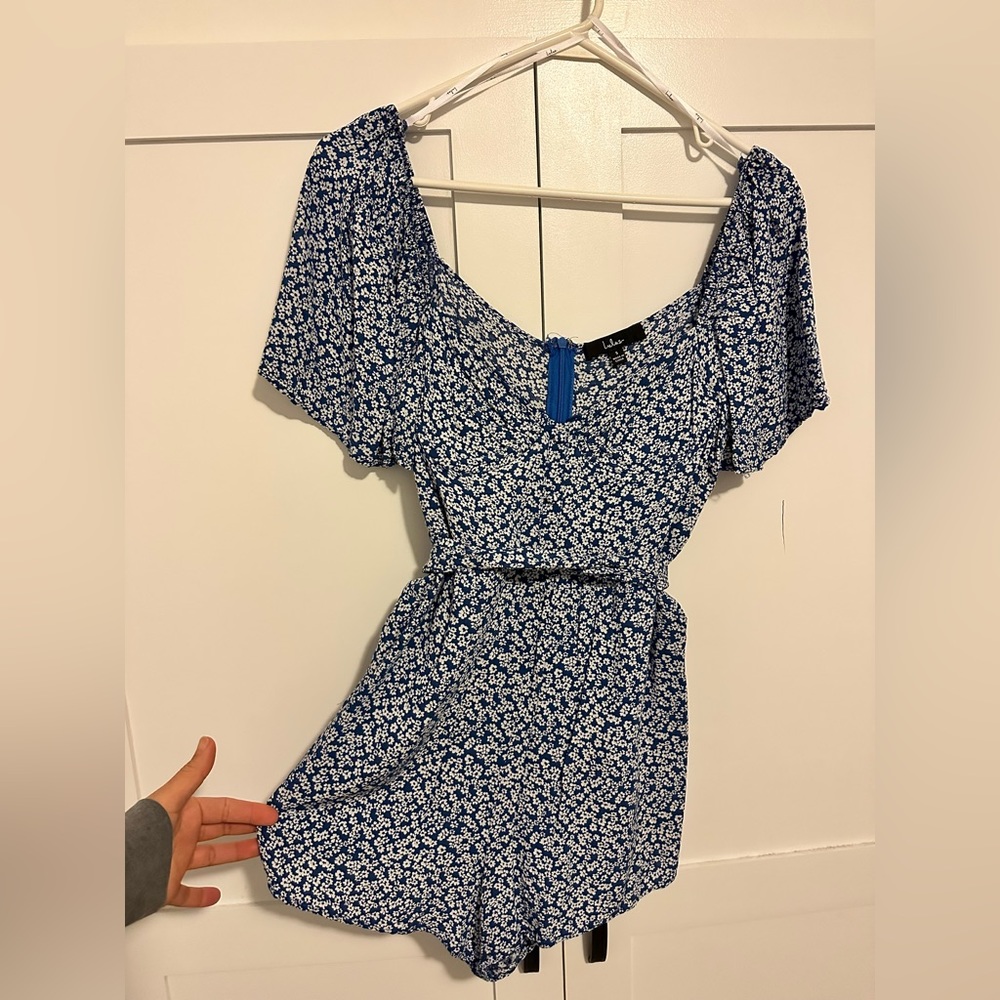 Blue floral romper - worn twice.  Has tie around waist if like and has pockets!